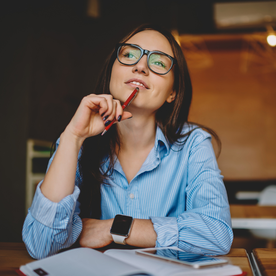 Woman smiling thinking about how to get better business skills and CPD.
